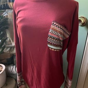 Long sleeve tunic length shirt.
